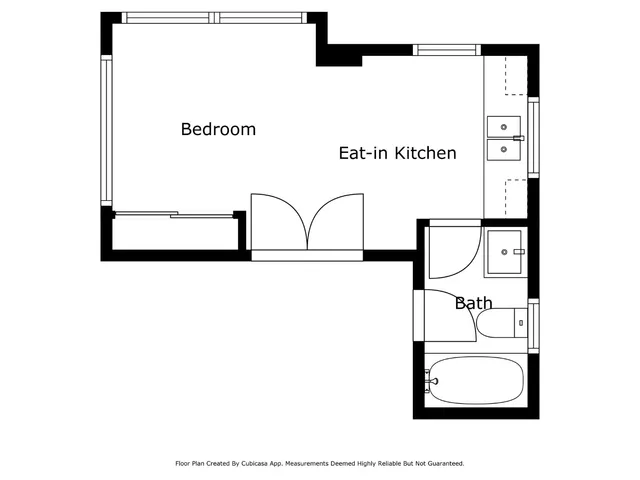 a picture of a bench in front of a wall