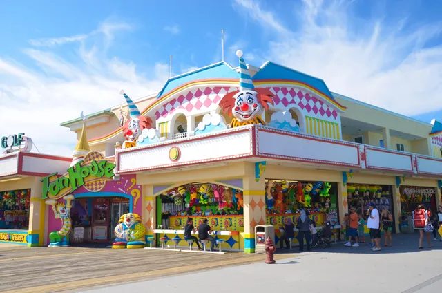 a view of a building with a umbrellas