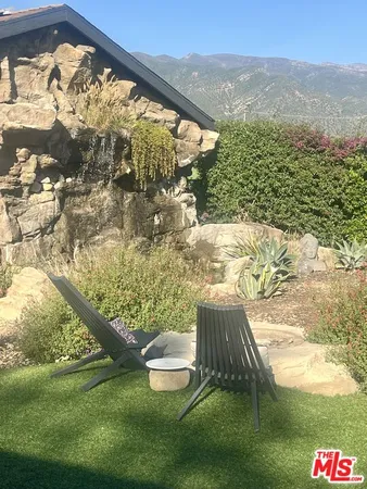 a view of swimming pool from a yard