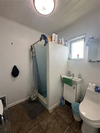 a bathroom with a toilet and a sink