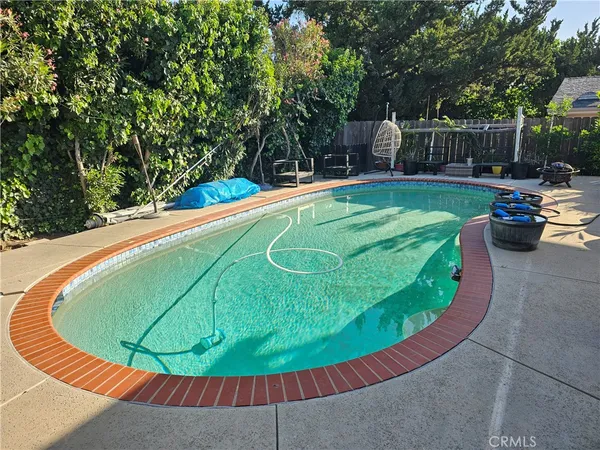 a view of a swimming pool with a patio