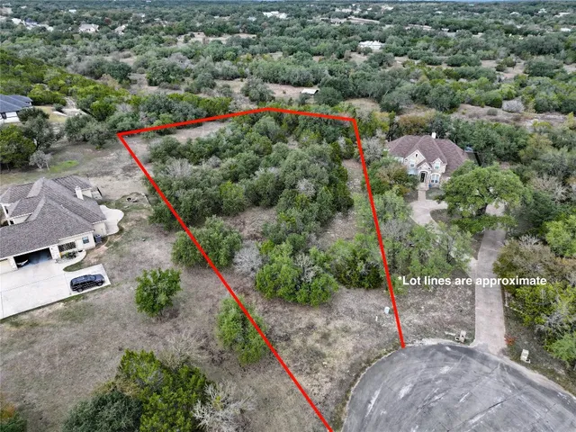 a view of a field with an ocean