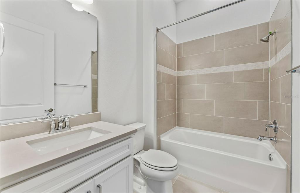 13655 Cyn Rdg Road Spring Hill, FL 34610 - Photo 12 of 28 a bathroom with a sink mirror toilet and bathtub