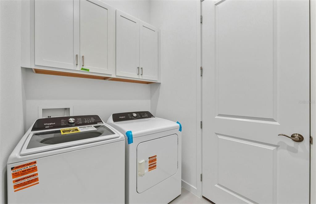 13655 Cyn Rdg Road Spring Hill, FL 34610 - Photo 14 of 28 a utility room with dryer and washer