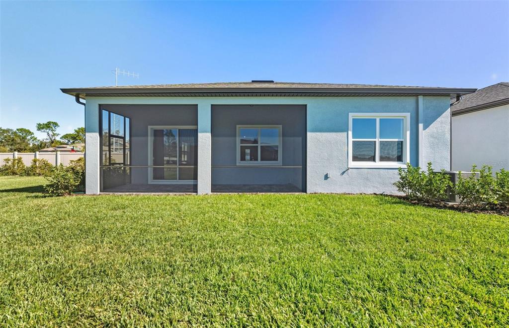 13655 Cyn Rdg Road Spring Hill, FL 34610 - Photo 15 of 28 front view of a house with a yard