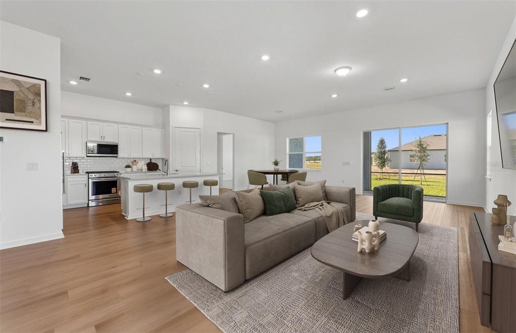 13655 Cyn Rdg Road Spring Hill, FL 34610 - Photo 2 of 28 a living room with furniture and kitchen view