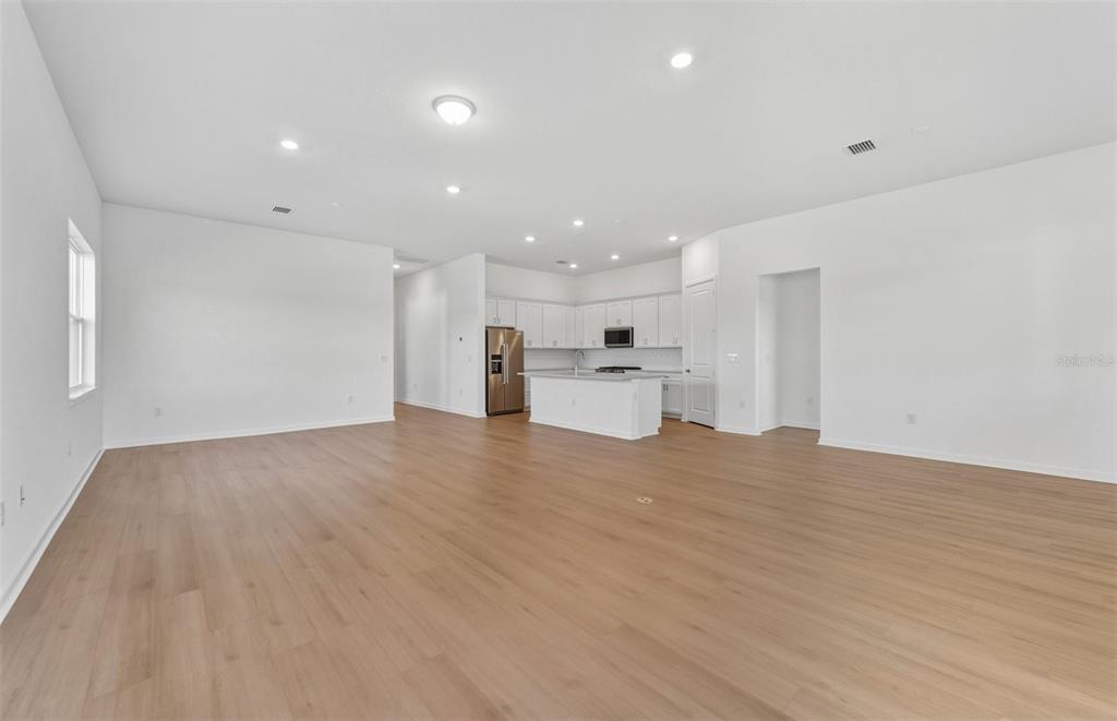 13655 Cyn Rdg Road Spring Hill, FL 34610 - Photo 6 of 28 a view of empty room with wooden floor