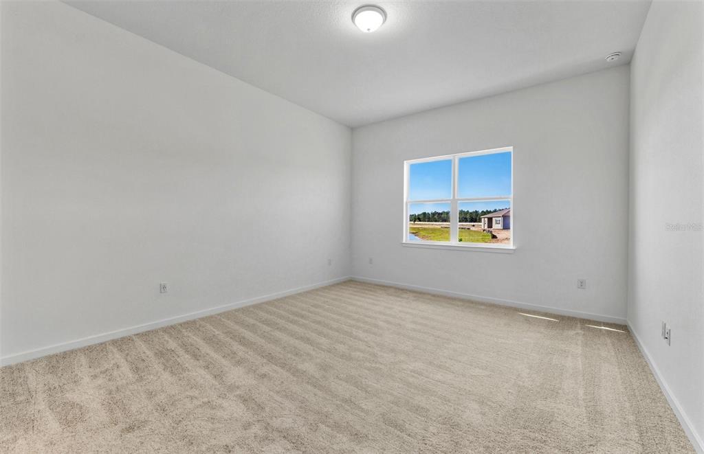 13655 Cyn Rdg Road Spring Hill, FL 34610 - Photo 8 of 28 an empty room with windows