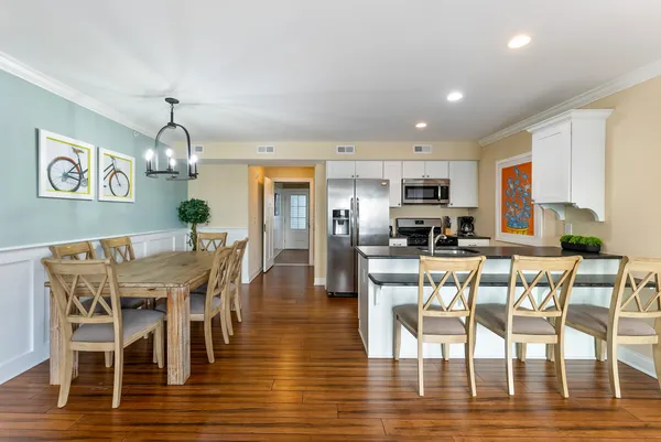a view of a dining room with furniture window and wooden floor