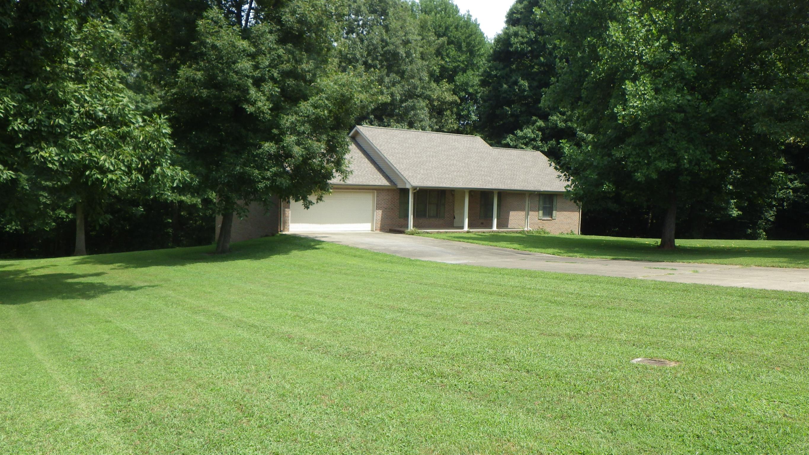 6502 North Pinson Road Portland, TN 37148 - Photo 1 of 22 a house view with a garden space