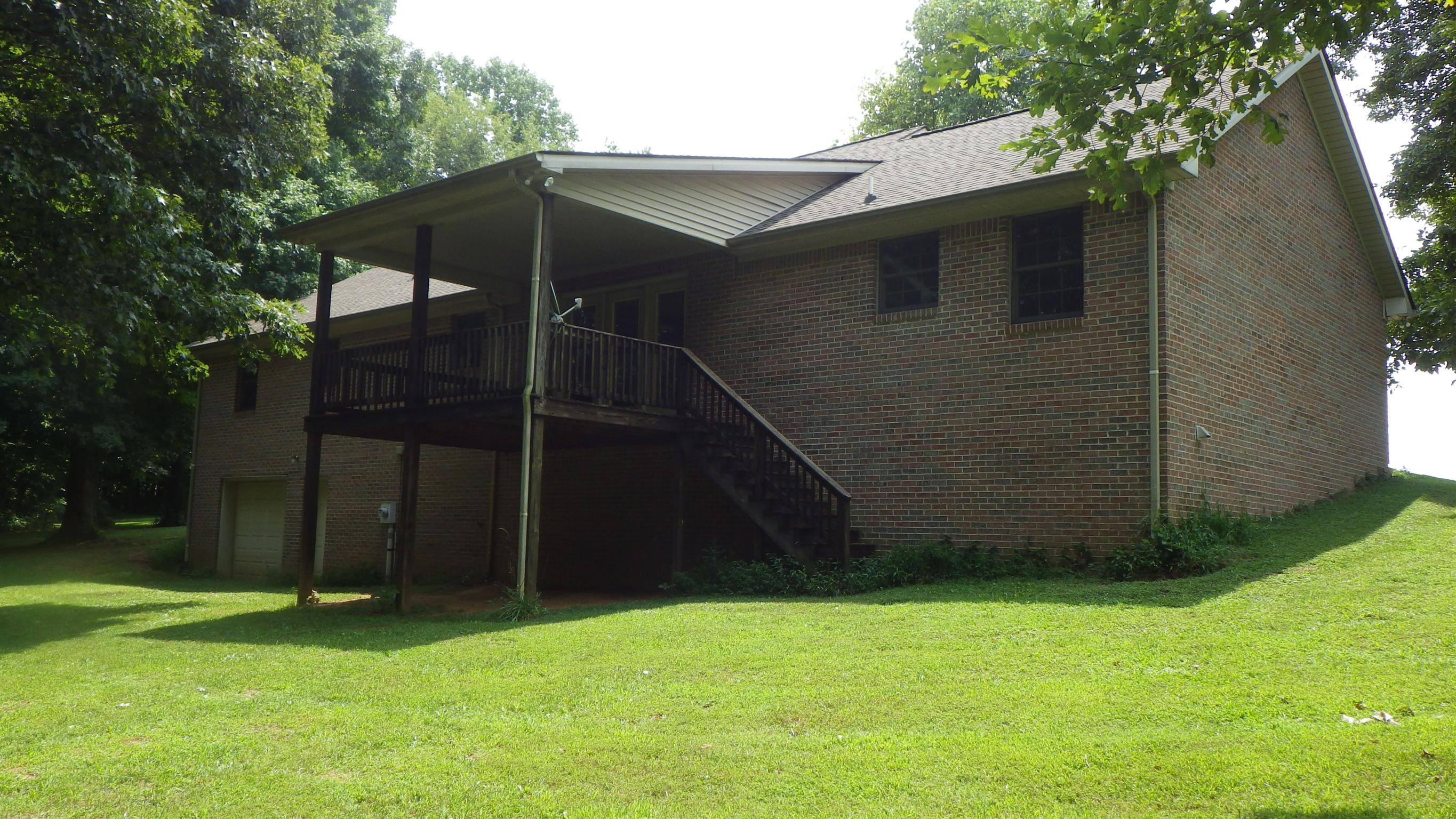 6502 North Pinson Road Portland, TN 37148 - Photo 7 of 22 a backyard of a house with lots of green space