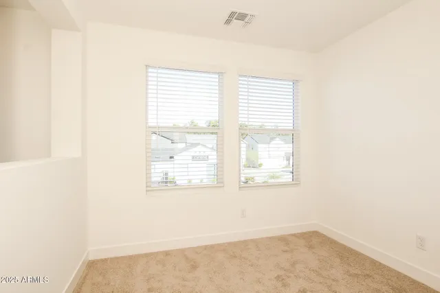 a kitchen with granite countertop a refrigerator and a stove top oven