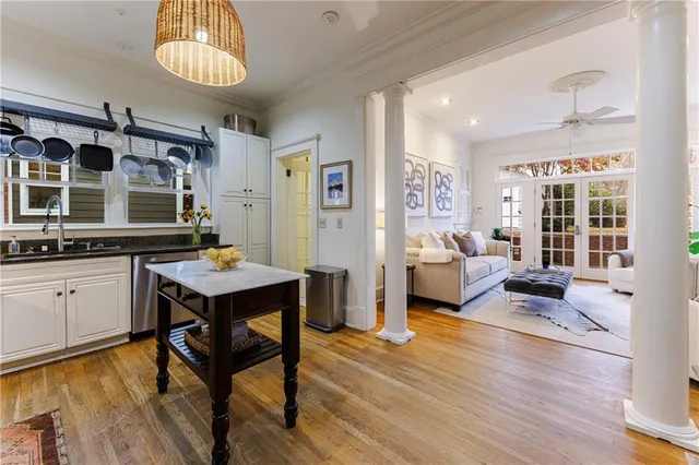 a living room with furniture window and wooden floor