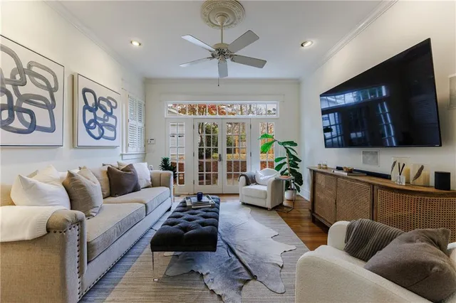 a view of a patio with lawn chairs under an umbrella