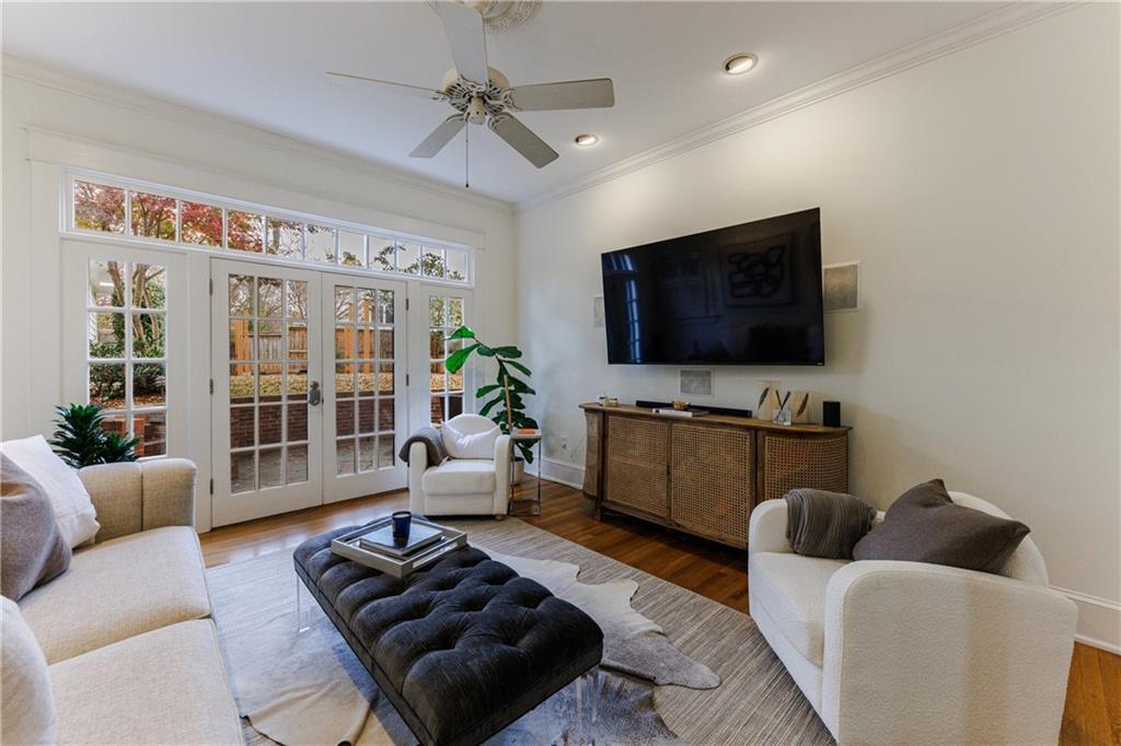 654 Cresthill Avenue Northeast Atlanta, GA 30306 - Photo 27 of 53 a living room with furniture and a flat screen tv