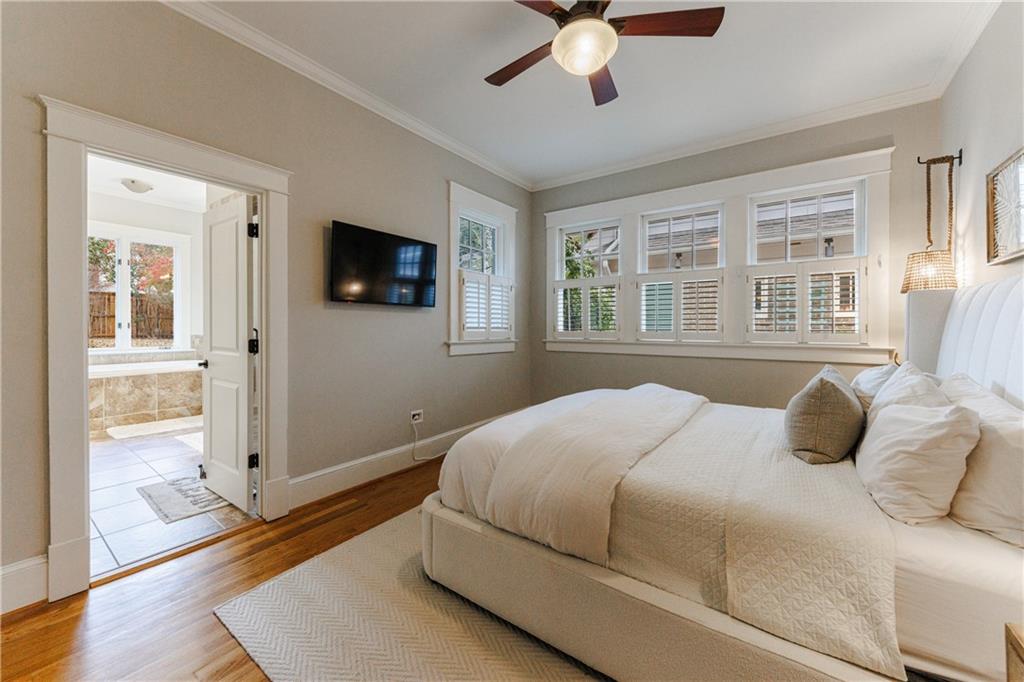 654 Cresthill Avenue Northeast Atlanta, GA 30306 - Photo 31 of 53 a bedroom with a bed and a flat screen tv