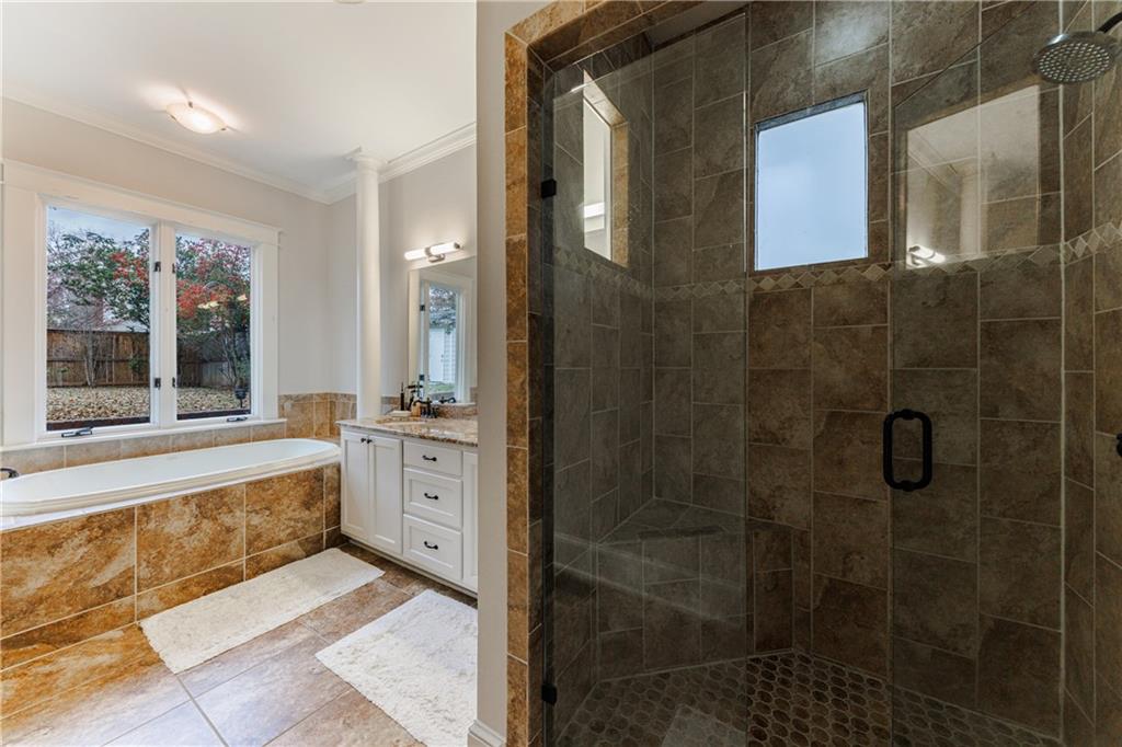 654 Cresthill Avenue Northeast Atlanta, GA 30306 - Photo 33 of 53 a spacious bathroom with a shower and a bathtub