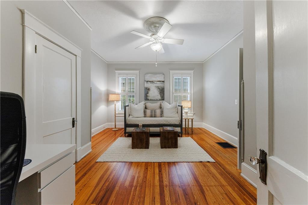 654 Cresthill Avenue Northeast Atlanta, GA 30306 - Photo 37 of 53 a living room with furniture and a chandelier