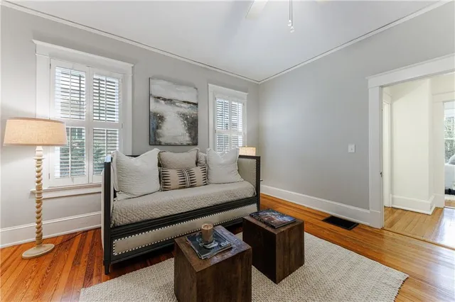 a bedroom with a bed a couch and dresser