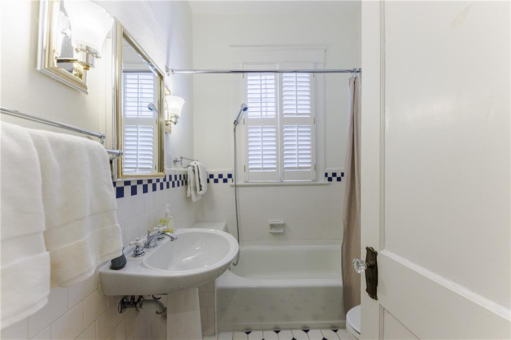 654 Cresthill Avenue Northeast Atlanta, GA 30306 - Photo 39 of 53 a bathroom with a sink a toilet and shower