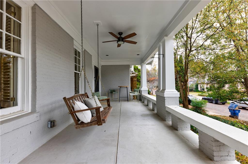 654 Cresthill Avenue Northeast Atlanta, GA 30306 - Photo 4 of 53 a living room with furniture and a floor to ceiling window