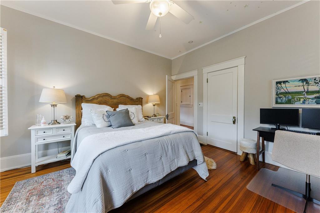 654 Cresthill Avenue Northeast Atlanta, GA 30306 - Photo 42 of 53 a bedroom with a bed and wooden floor