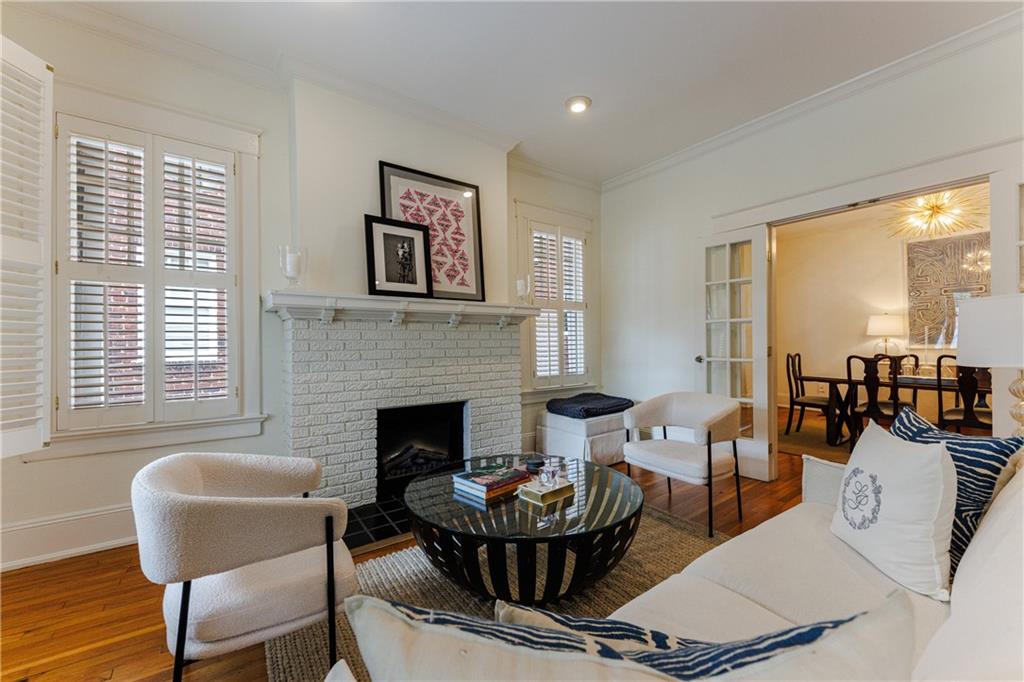 654 Cresthill Avenue Northeast Atlanta, GA 30306 - Photo 8 of 53 a living room with furniture and a fireplace