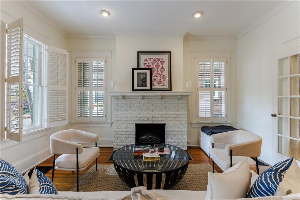 654 Cresthill Avenue Northeast Atlanta, GA 30306 - Photo 9 of 53 a living room with furniture and a fireplace