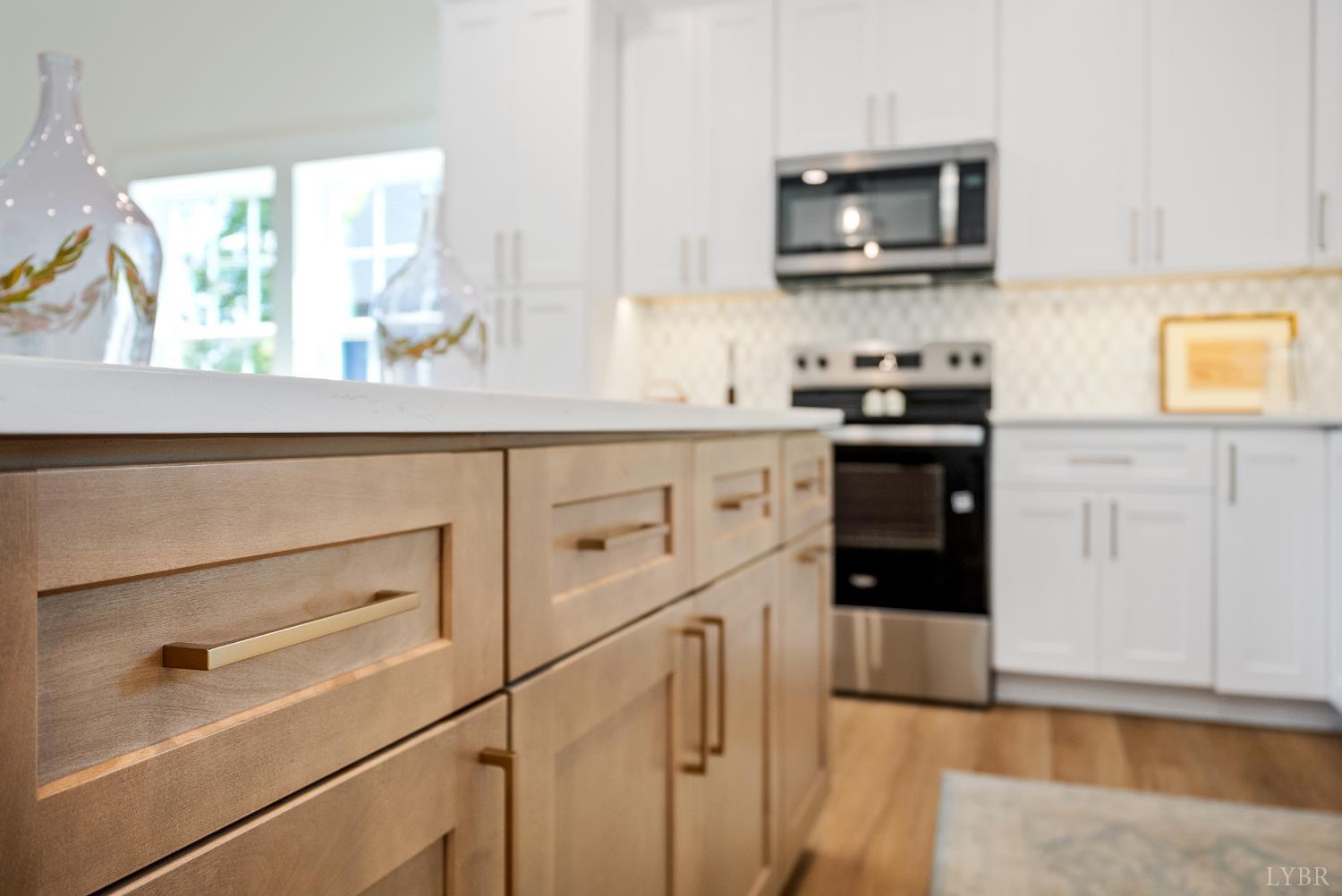 10 Madison Avenue Danville, VA 24540 - Photo 8 of 44 a kitchen with stainless steel appliances granite countertop a stove and a microwave
