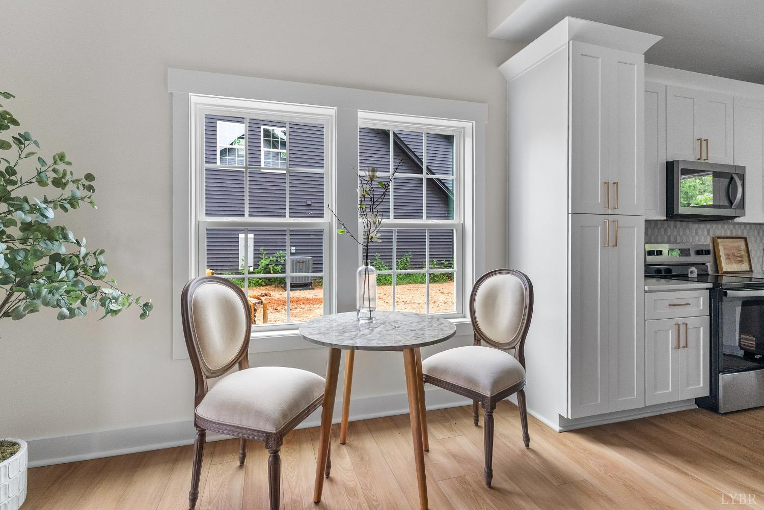 10 Madison Avenue Danville, VA 24540 - Photo 10 of 44 a view of a dining room with furniture window and wooden floor