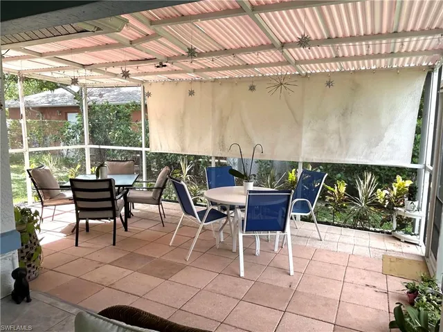 a view of a room with wooden floor and outdoor space
