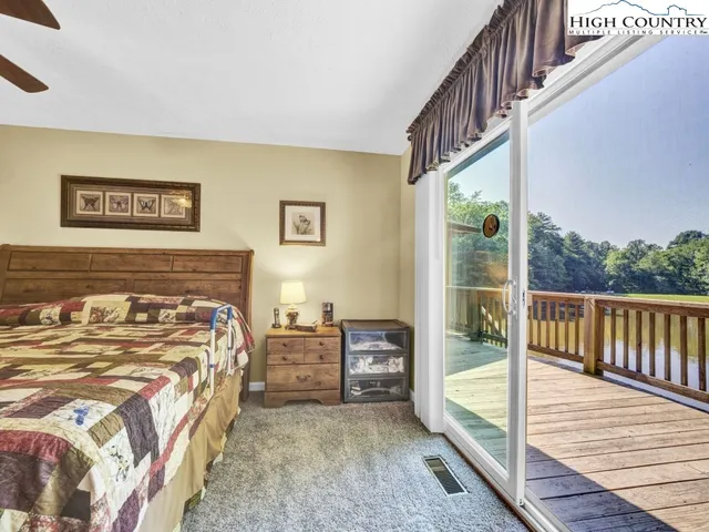 a view of a bedroom with furniture and staircase