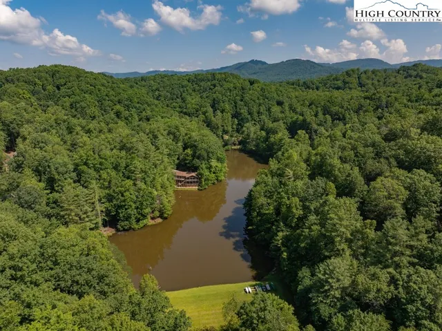 a view of a lake with a yard