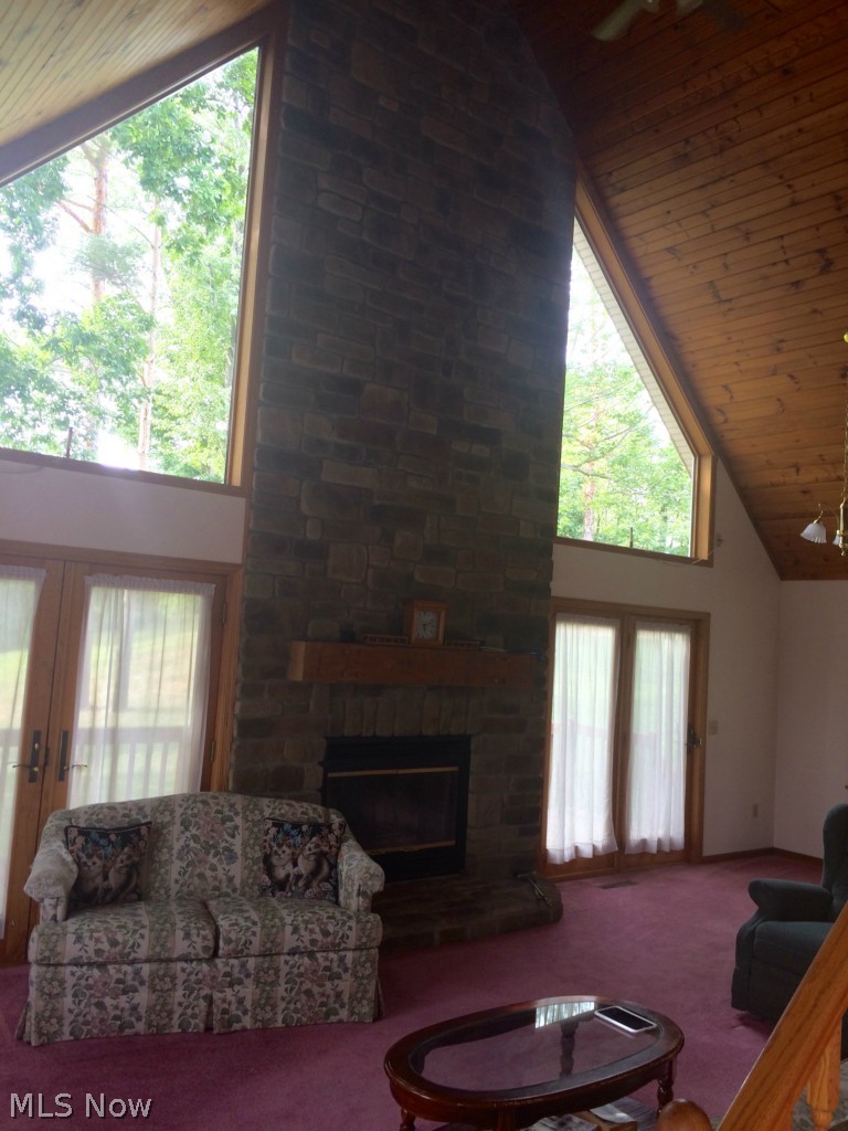 Stunning stone fireplace provides beauty and warmth for this spacious living room.