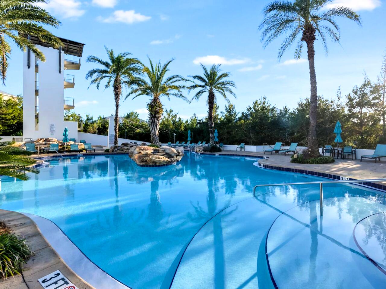 a swimming pool with chairs