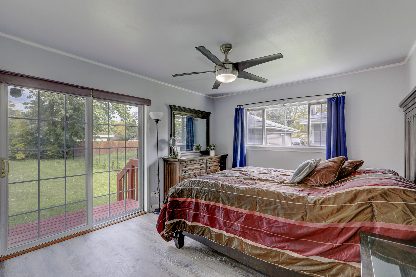 3 Manor Road Lake Zurich, IL 60047 - Photo 15 of 35 a bedroom with a bed and a chandelier