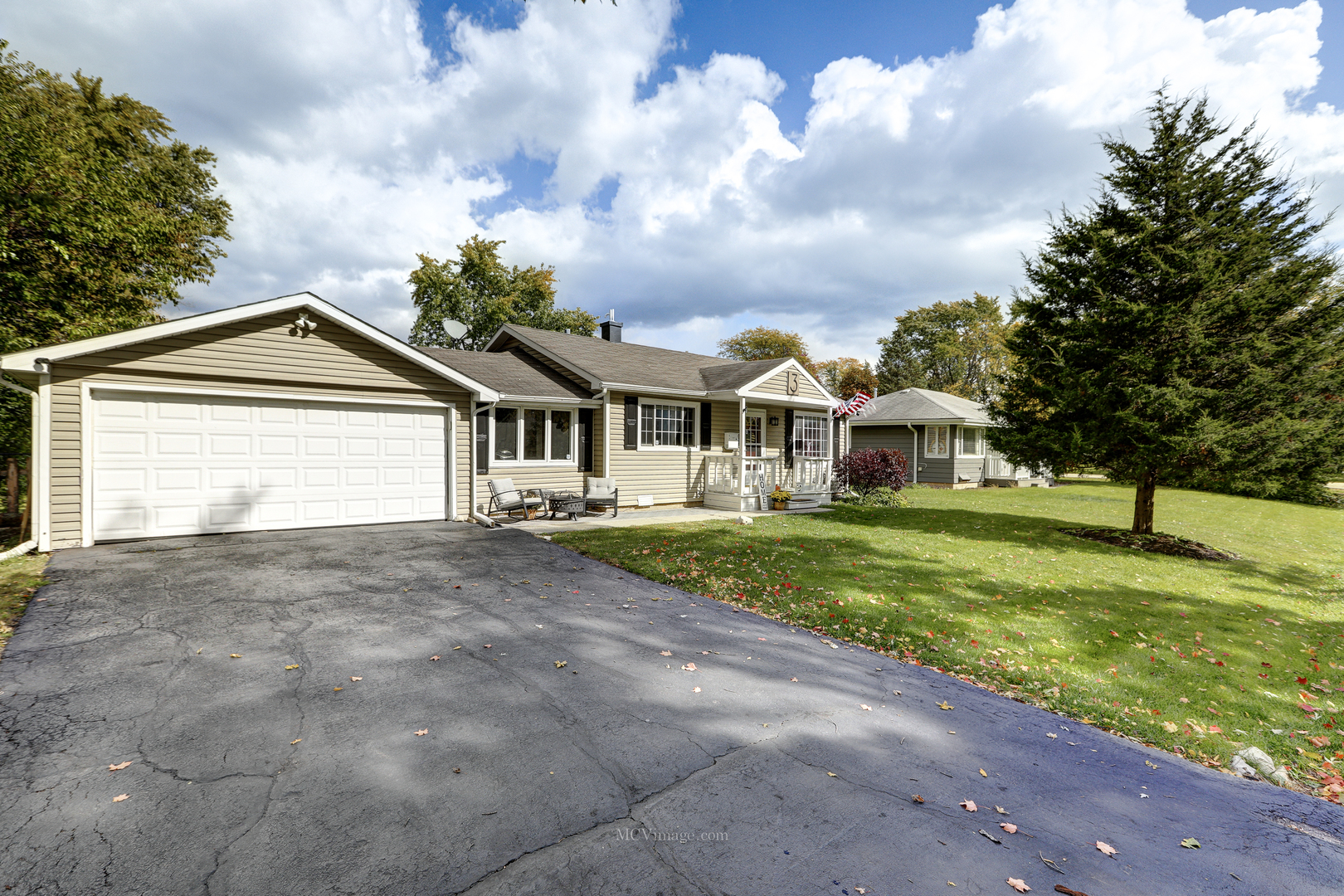 3 Manor Road Lake Zurich, IL 60047 - Photo 2 of 35 a view of a house with a big yard and large trees