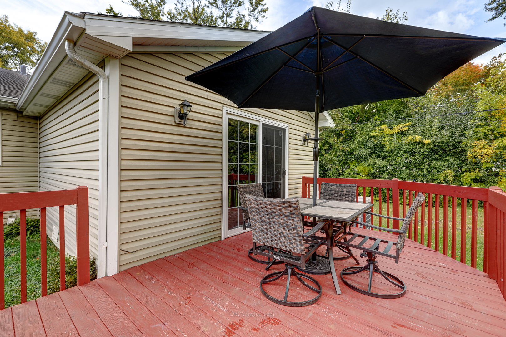 3 Manor Road Lake Zurich, IL 60047 - Photo 23 of 35 a view of balcony with furniture and umbrella