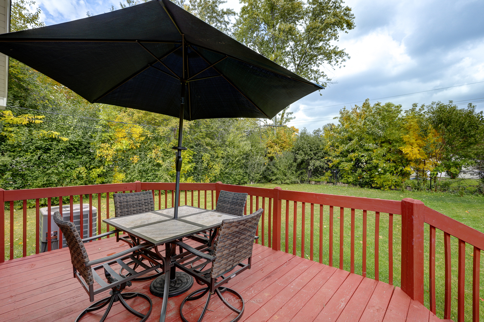 3 Manor Road Lake Zurich, IL 60047 - Photo 24 of 35 a view of balcony with furniture and umbrella