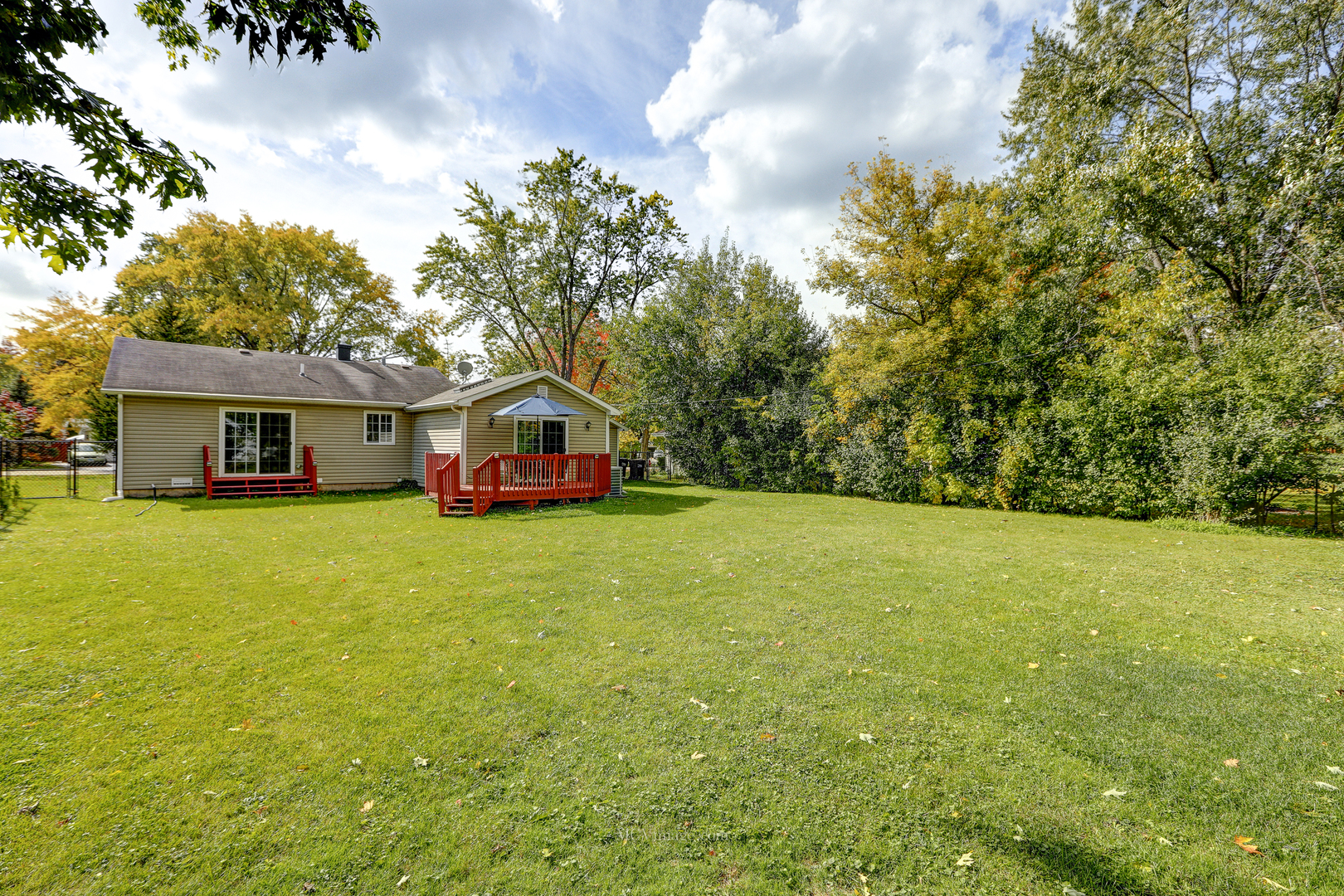 3 Manor Road Lake Zurich, IL 60047 - Photo 26 of 35 a front view of house with yard and trees in the background