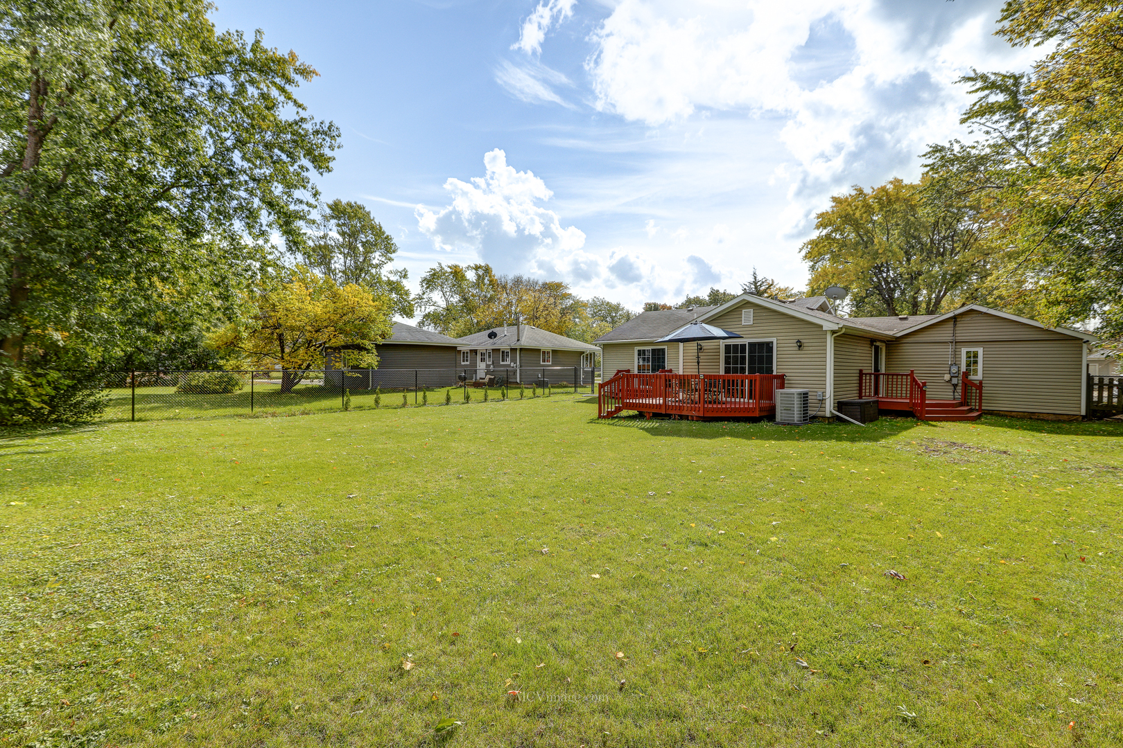 3 Manor Road Lake Zurich, IL 60047 - Photo 27 of 35 a view of a house with a big yard with table and chairs