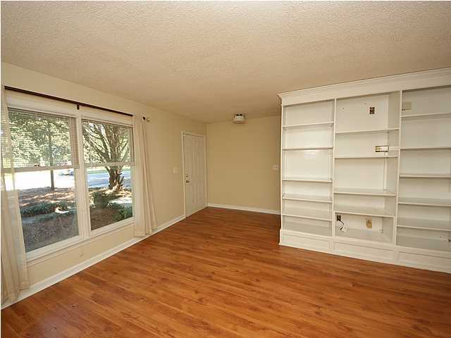 1391 Camp Road, Unit A Charleston, SC 29412 - Photo 4 of 19 Living room with built-in bookshelves