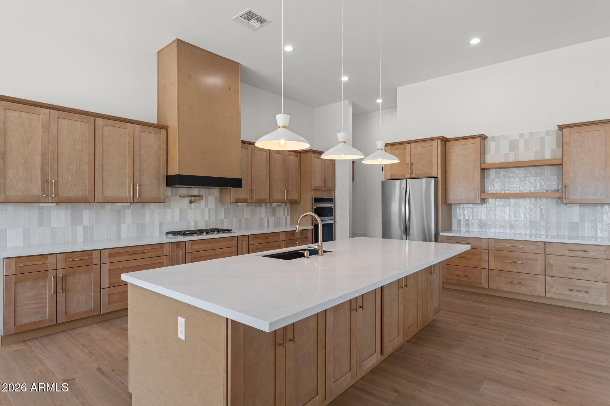 2855 Percheron Road Wickenburg, AZ 85390 - Photo 21 of 58 a kitchen with a sink a stove a refrigerator and cabinets