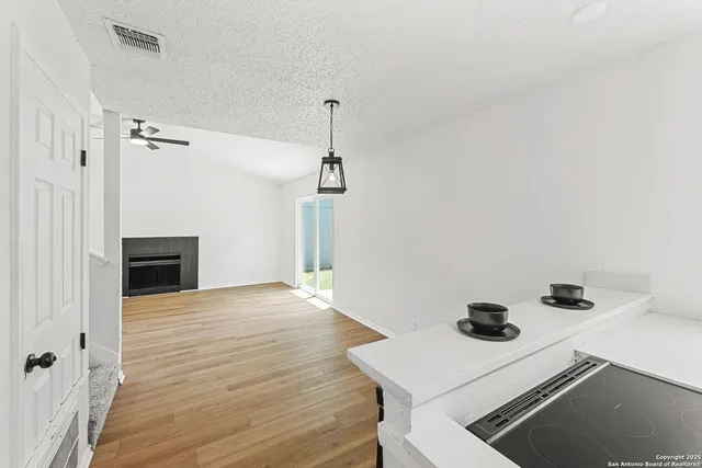 a view of storage and utility room with wooden floor