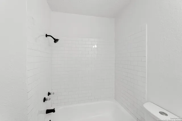 a bathroom with a bathtub