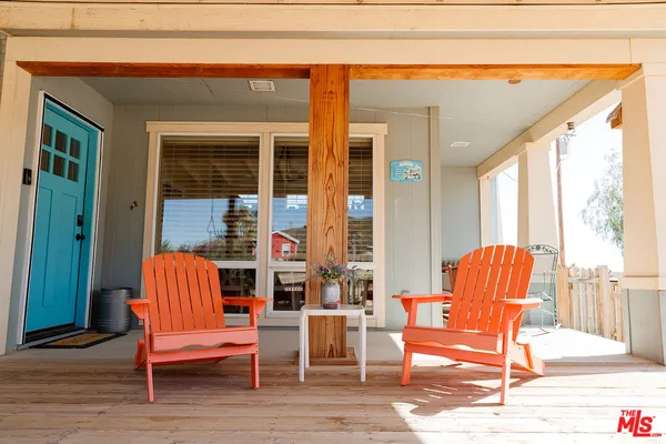 a outdoor view with a sitting space and large windows