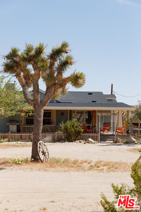 55626 Pipes Canyon Road Yucca Valley, CA 92284 - Photo 22 of 61 a view of a building with a street