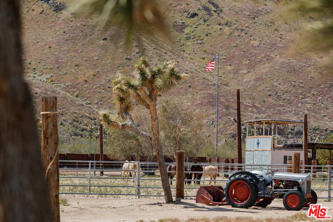 55626 Pipes Canyon Road Yucca Valley, CA 92284 - Photo 34 of 61 a car parked on the side of the road