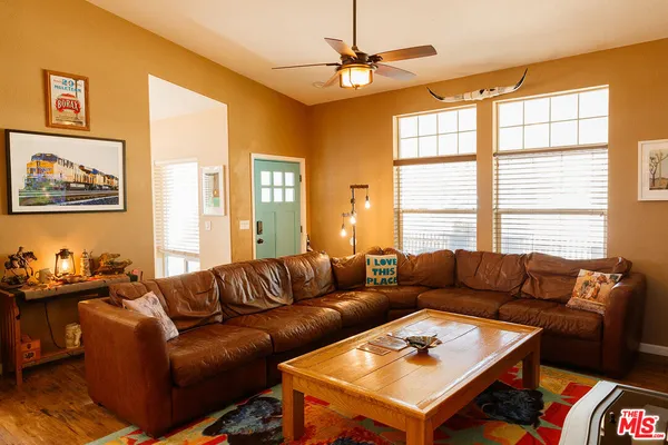 a living room with furniture and a window