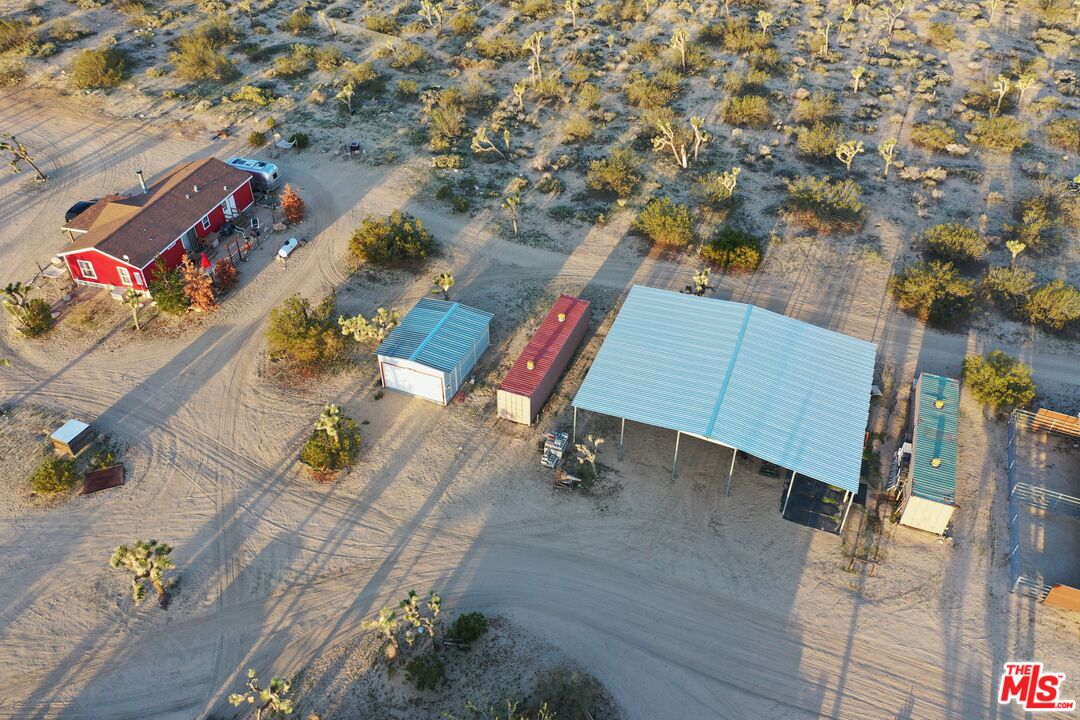55626 Pipes Canyon Road Yucca Valley, CA 92284 - Photo 55 of 61 an aerial view of a chairs and table on the terrace